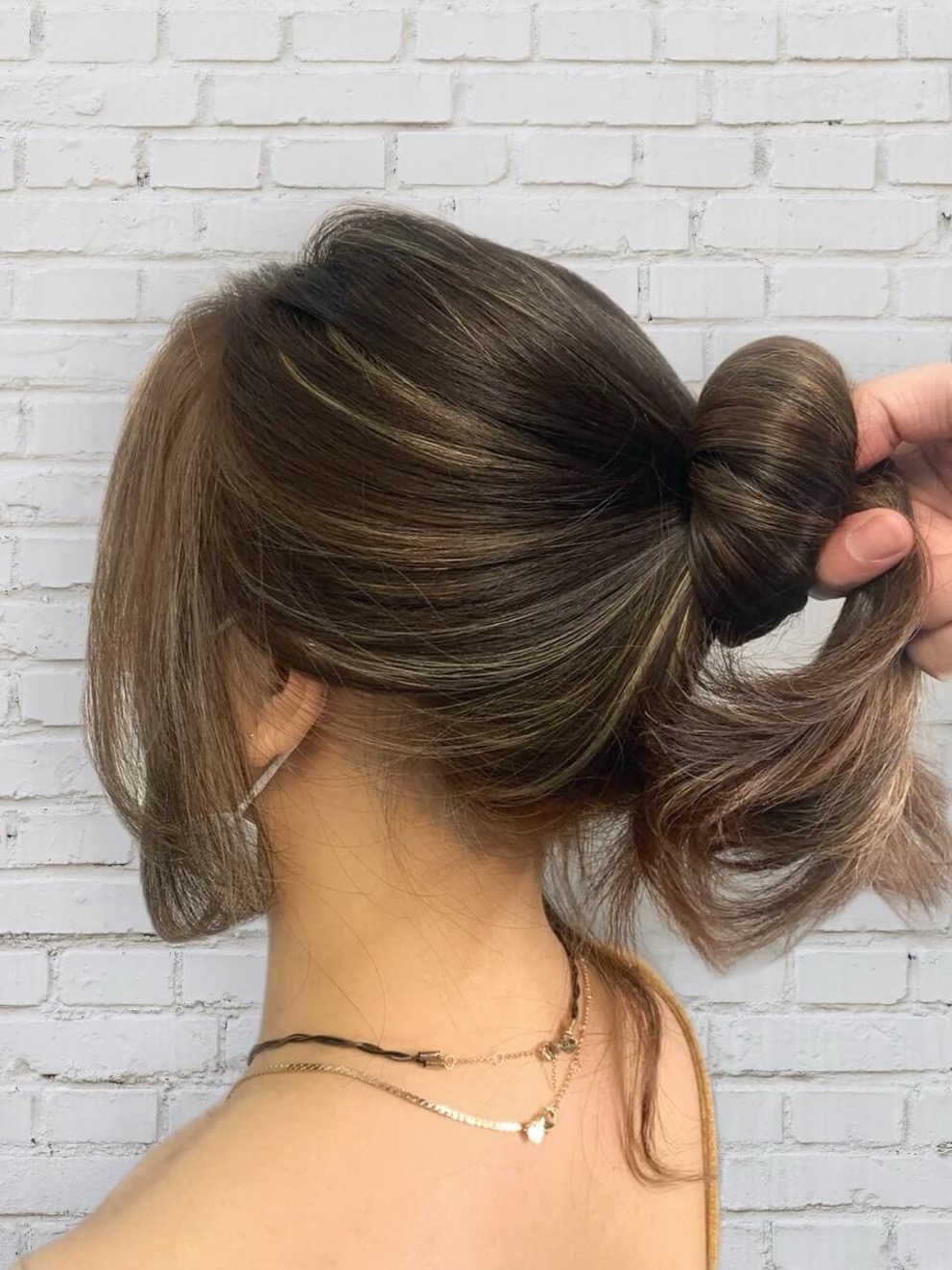 Hair Colour Trend 2022: Ash Brown Falling Stars Highlights designed by Associate Director of Chez Vous: HideAway, Jessie Wong